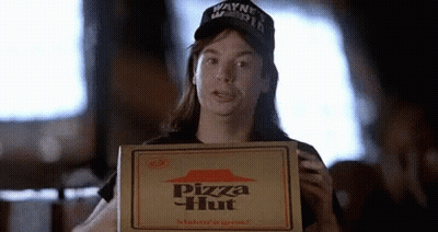 A Woman Is Holding A Pizza Hut Box In Her Hand . GIF