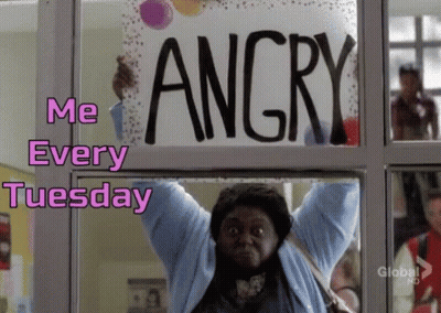 A Woman Is Holding A Sign That Says Angry Over Her Head GIF
