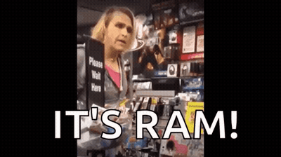 A Woman Is Holding A Sign That Says It 'S Ram . GIF