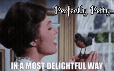 A Woman Is Holding A Small Bird In Her Hands And Singing To It . GIF