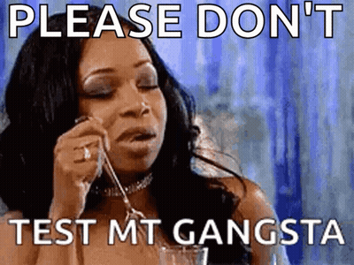 A Woman Is Holding A Spoon In Her Mouth And Says Please Don 'T Test Mt Gangsta . GIF