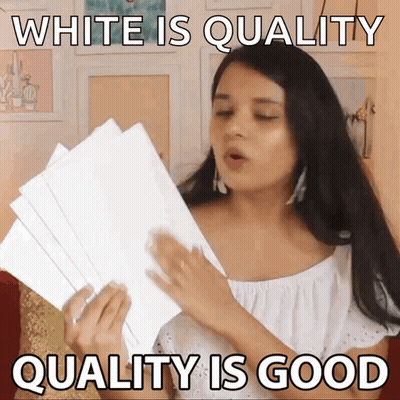 A Woman Is Holding A Stack Of White Papers And Says " White Is Quality Quality Is Good " GIF