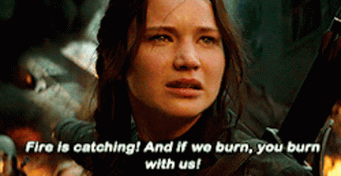 A Woman Is Holding A Sword And Says Fire Is Catching And If We Burn , You Burn With Us . GIF