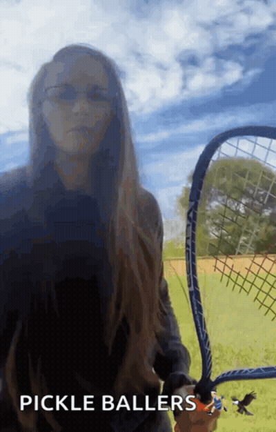 A Woman Is Holding A Tennis Racket With The Words Pickle Ballers Below Her GIF