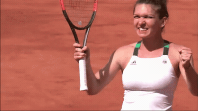 A Woman Is Holding A Tennis Racquet And Wearing An Adidas Shirt GIF