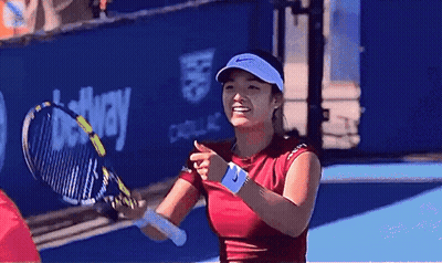 A Woman Is Holding A Tennis Racquet On A Court With A Betway Sign In The Background GIF