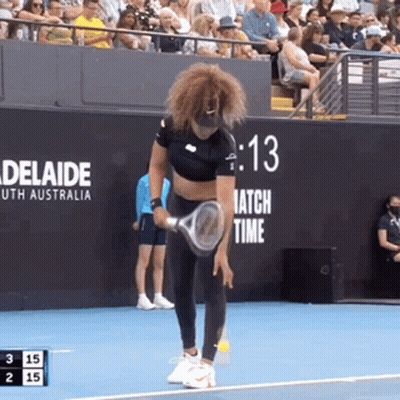 A Woman Is Holding A Tennis Racquet On A Tennis Court With A Sign That Says Adelaide On It GIF