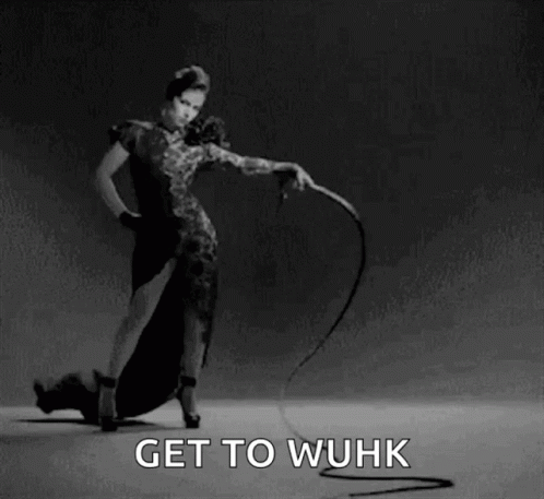 A Woman Is Holding A Whip In A Black And White Photo With The Words Get To Wuhk Below Her GIF