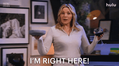 A Woman Is Holding A Wine Glass And A Plate And Says I 'M Right Here GIF
