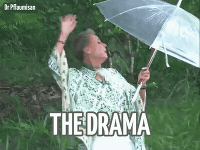 A Woman Is Holding An Umbrella In The Rain And The Word The Drama Is On The Bottom Right GIF