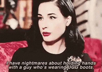 A Woman Is Holding Hands With A Man Who Is Wearing Ugg Boots GIF