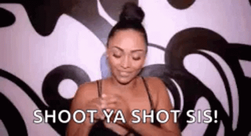 A Woman Is Holding Her Breasts In Front Of A Wall And Says `` Shoot Ya Shot Sis ! '' GIF