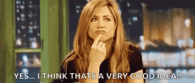 A Woman Is Holding Her Finger To Her Chin And Thinking About A Very Good Idea . GIF