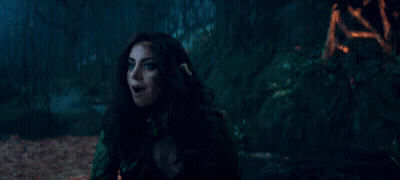 A Woman Is Holding Something In Her Hand And The Word Surprise Is On The Bottom Right GIF