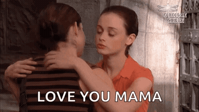 A Woman Is Hugging A Man With The Words `` Love You Mama '' Written On The Bottom . GIF