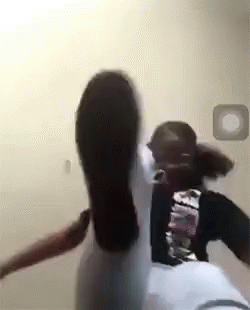 A Woman Is Kicking A Man In The Face While Sitting On A Float . GIF