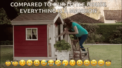 A Woman Is Kneeling On A Chair In Front Of A Playhouse With The Words Compared To Your Little House Everything Is A Mans GIF