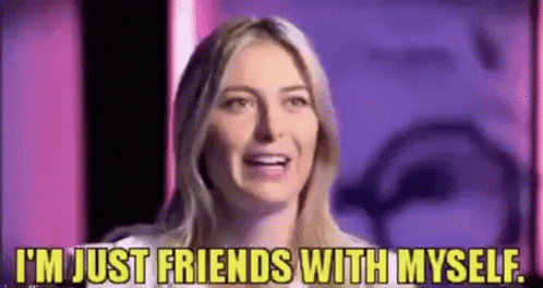 A Woman Is Laughing And Saying `` I 'M Just Friends With Myself '' . GIF