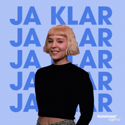 A Woman Is Laughing In Front Of A Blue Background That Says Ja Klar Jaar GIF