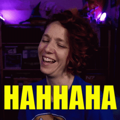 A Woman Is Laughing In Front Of A Sign That Says Nahhaha GIF