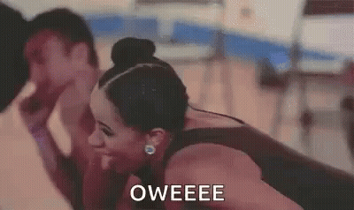 A Woman Is Laughing With A Man In A Gym And The Words Oweee Are On The Screen . GIF