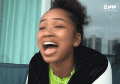 A Woman Is Laughing With A Watermark That Says Ovo On It GIF