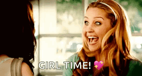 A Woman Is Laughing With Her Mouth Open And The Words `` Girl Time '' Written On The Screen . GIF