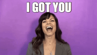 a woman is laughing with her mouth open and the words `` i got you '' written above her .