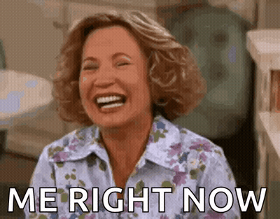 A Woman Is Laughing With The Words `` Me Right Now '' Written Next To Her . GIF
