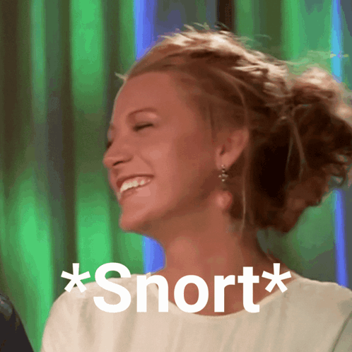 A Woman Is Laughing With The Words * Snort * Written On Her Shirt GIF