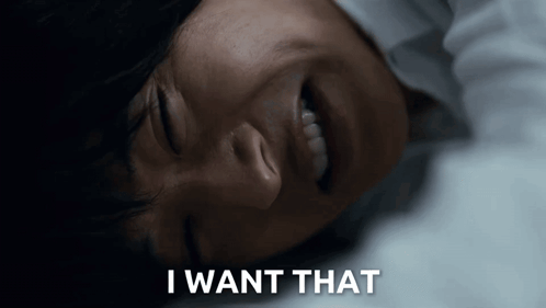 A Woman Is Laying Down With Her Eyes Closed And The Words I Want That Written Below Her GIF