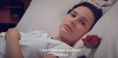 A Woman Is Laying In A Hospital Bed With A Rose And Says " I Don 'T Love You Anymore " GIF