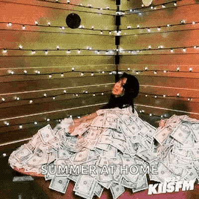 A Woman Is Laying In A Pile Of Money With The Words Summer At Home Written On The Bottom GIF