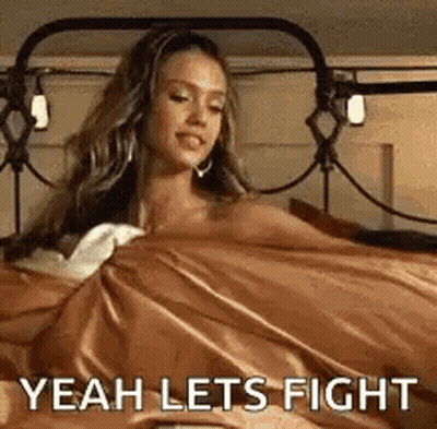 A Woman Is Laying In Bed With A Blanket On Her Head And The Words `` Yeah Lets Fight '' . GIF
