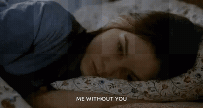 A Woman Is Laying In Bed With Her Head On A Pillow With The Words `` Me Without You '' Written Above Her . GIF