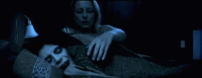 A Woman Is Laying On A Couch With A Ghostly Figure Behind Her GIF