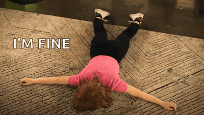 A Woman Is Laying On Her Back With The Words I 'M Fine Behind Her GIF
