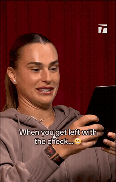 A Woman Is Looking At A Cell Phone And Says When You Get Left With The Check GIF