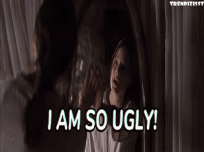 A Woman Is Looking At Herself In A Mirror And Says I Am So Ugly ! GIF