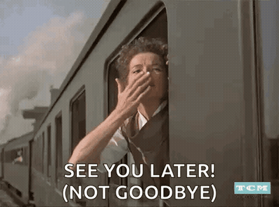 A Woman Is Looking Out Of A Train Window And Covering Her Face . GIF