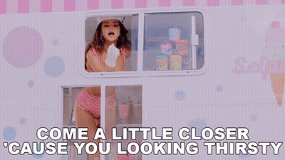 A Woman Is Looking Out Of An Ice Cream Truck With The Words Come A Little Closer Cause You Looking Thirsty Written Below GIF