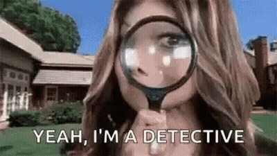 A Woman Is Looking Through A Magnifying Glass . GIF