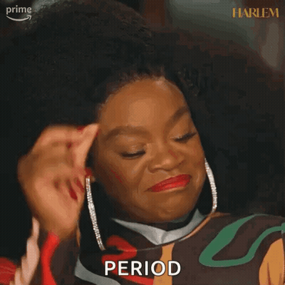 A Woman Is Making A Funny Face And Holding Her Hand To Her Forehead . GIF
