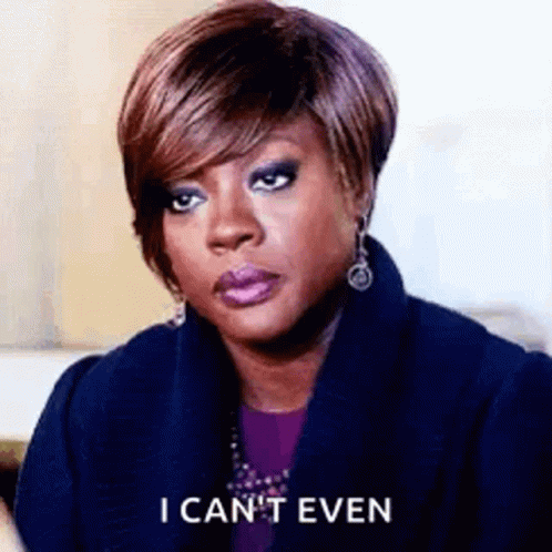 A Woman Is Making A Funny Face And Saying `` I Can 'T Even '' While Wearing A Blue Coat . GIF