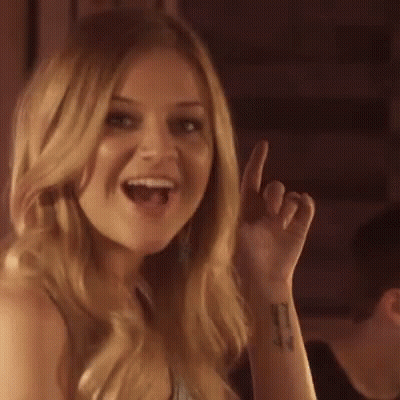 A Woman Is Making A Funny Face And Saying `` I Like That '' While Giving A Thumbs Up . GIF