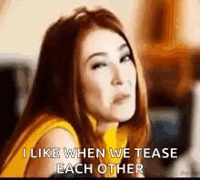 A Woman Is Making A Funny Face And Saying `` I Like When We Tease Each Other `` . GIF