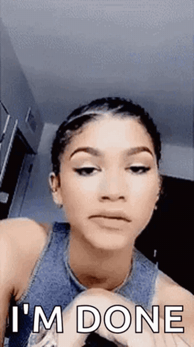 A Woman Is Making A Funny Face And Saying `` I 'M Done '' While Looking At The Camera . GIF
