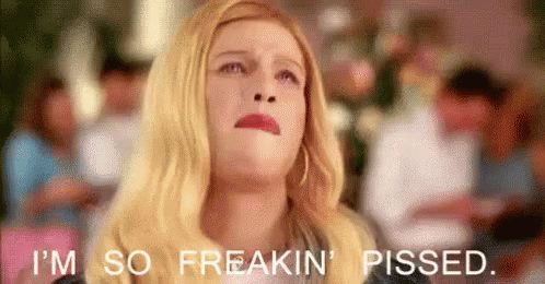 A Woman Is Making A Funny Face And Saying `` I 'M So Freakin ' Pissed '' . GIF