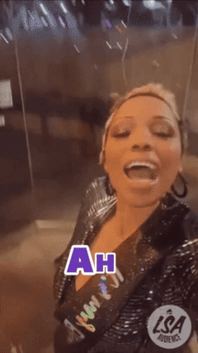 A Woman Is Making A Funny Face And The Words Ah Ha Are On The Screen GIF