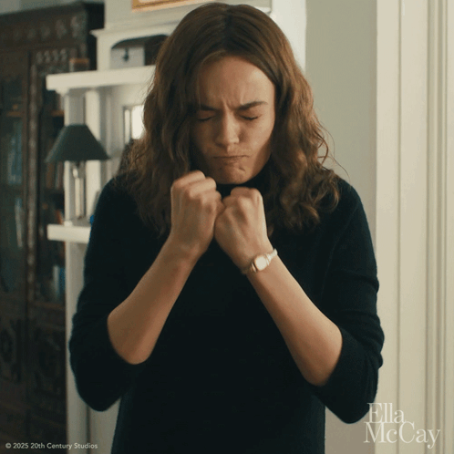 A Woman Is Making A Funny Face In A Ella Mccay Movie GIF
